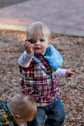 William presents a pinecone